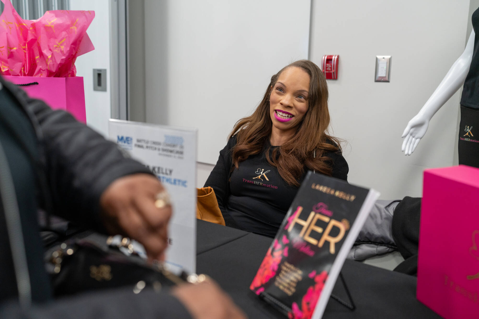 Lakeea Kelly tabling at the Battle Creek Innovation Hub before the pitch competition